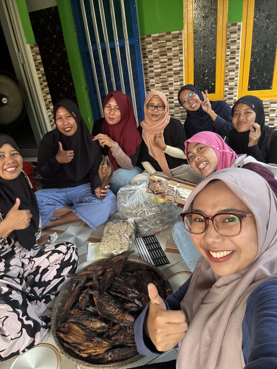 Sharing a meal with women from the community