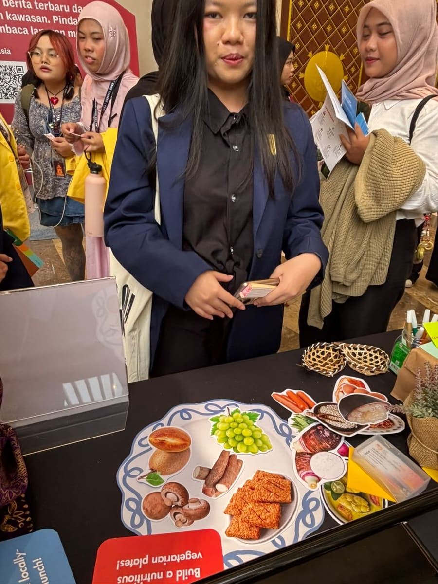 Visitors at a Foodie Loka food stand