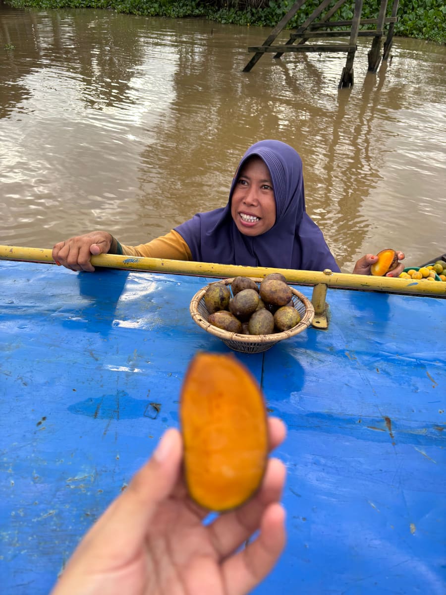 Sharing local produce on a riverbank
